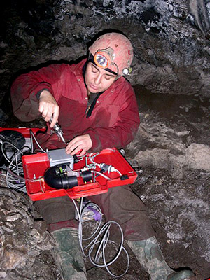 Trish wiring up one of our home made drip sensors for her post-doc research (2004)