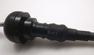 Use a couple of sizes of heat shrink tube to seal the cable to the pex adapter