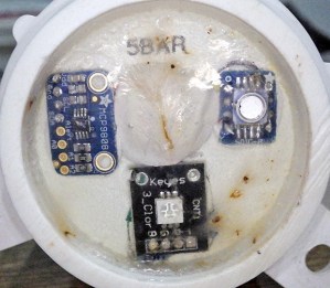The suspect MCP9808 (upper left). I have moved away from these large surface area sensor wells as I think they might be subjecting the sensors to larger bowing forces at depth.